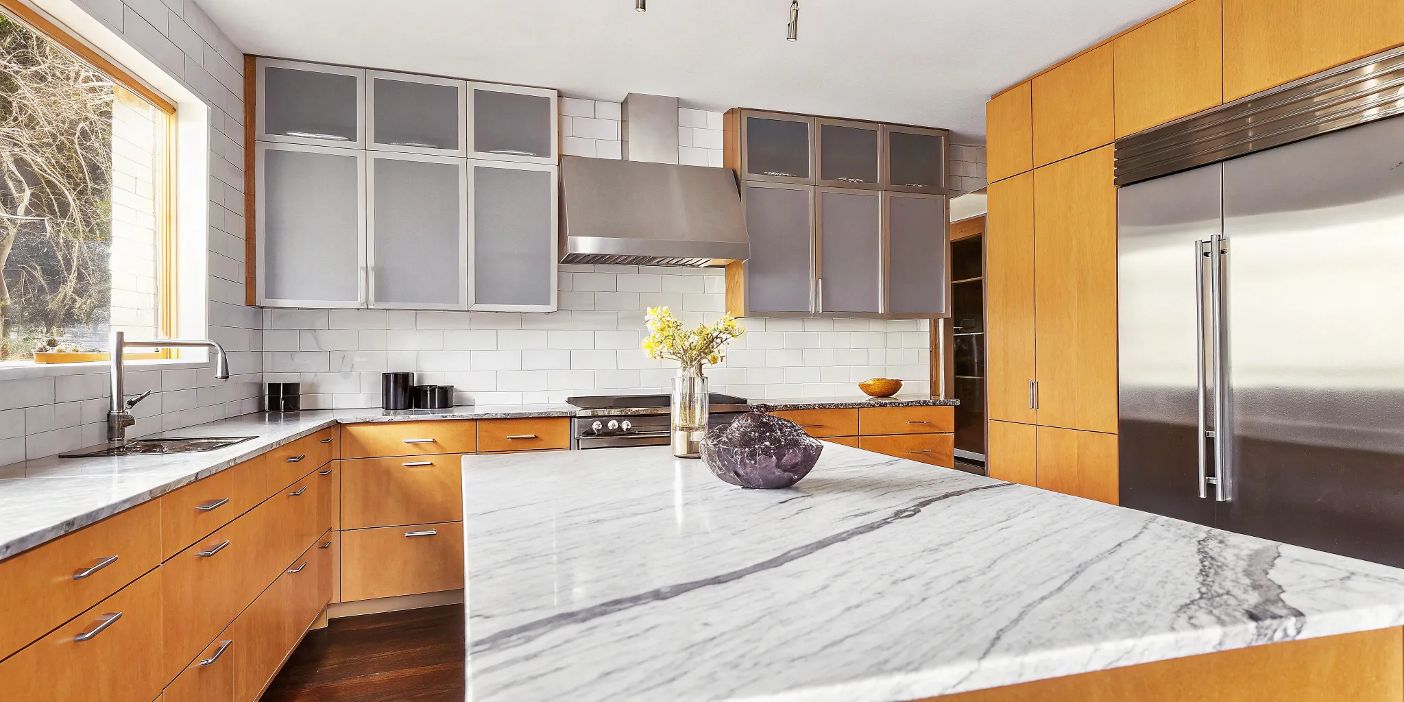 A modern kitchen remodel with materials that are calculated in a project cost estimator.