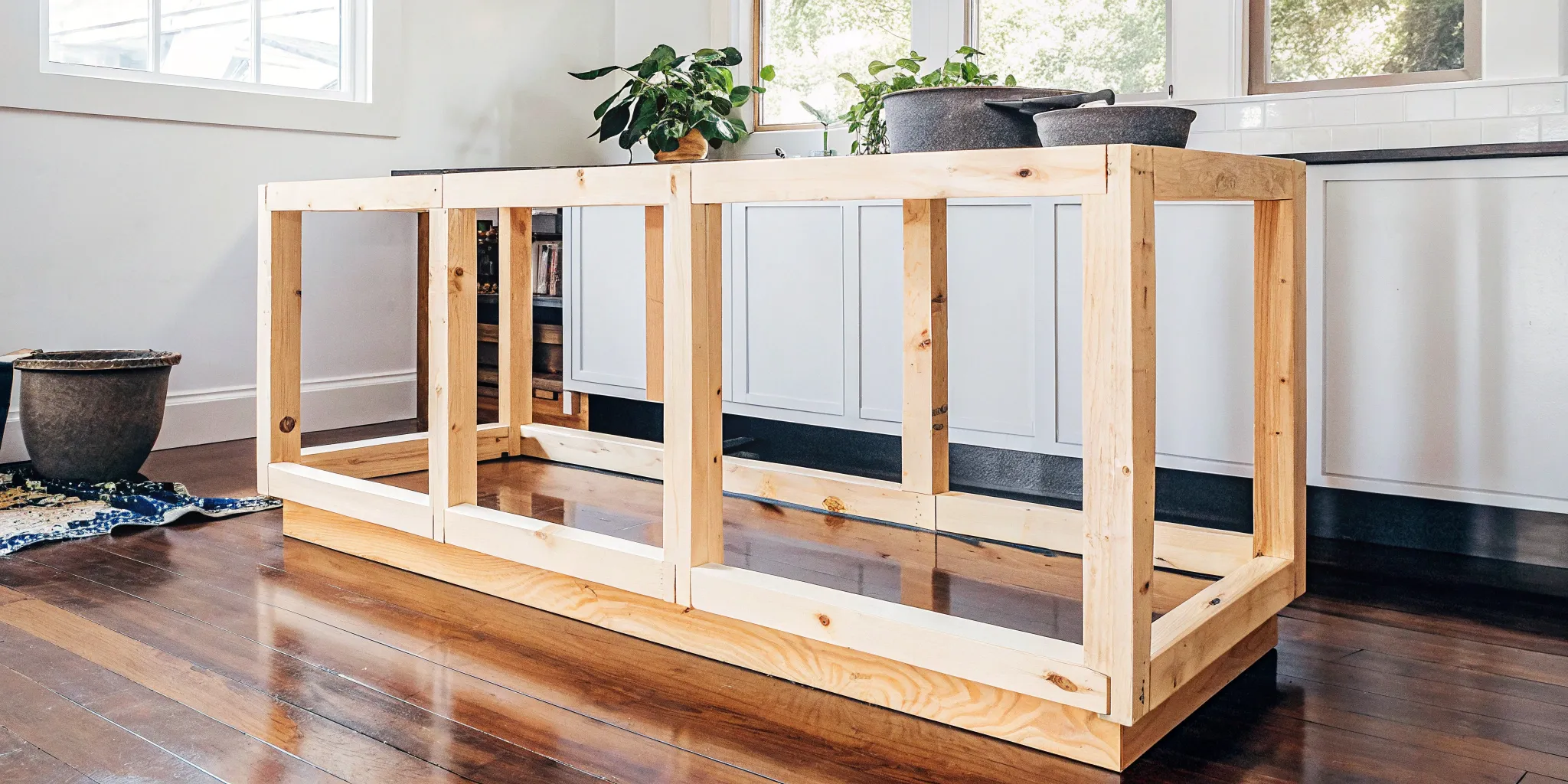 Unfinished kitchen island base without a top, ready for a custom countertop.