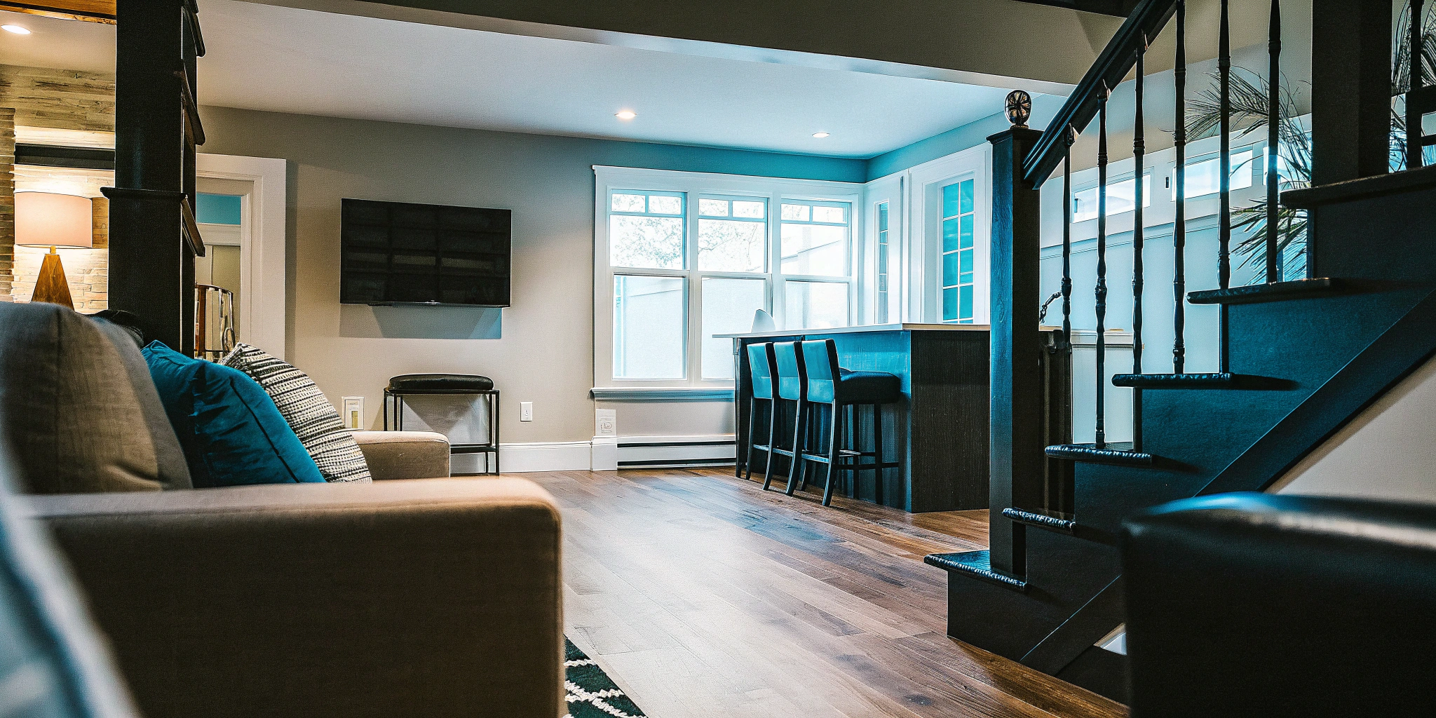 A modern Chicago basement remodel with an open floor plan, home bar, and great natural light.